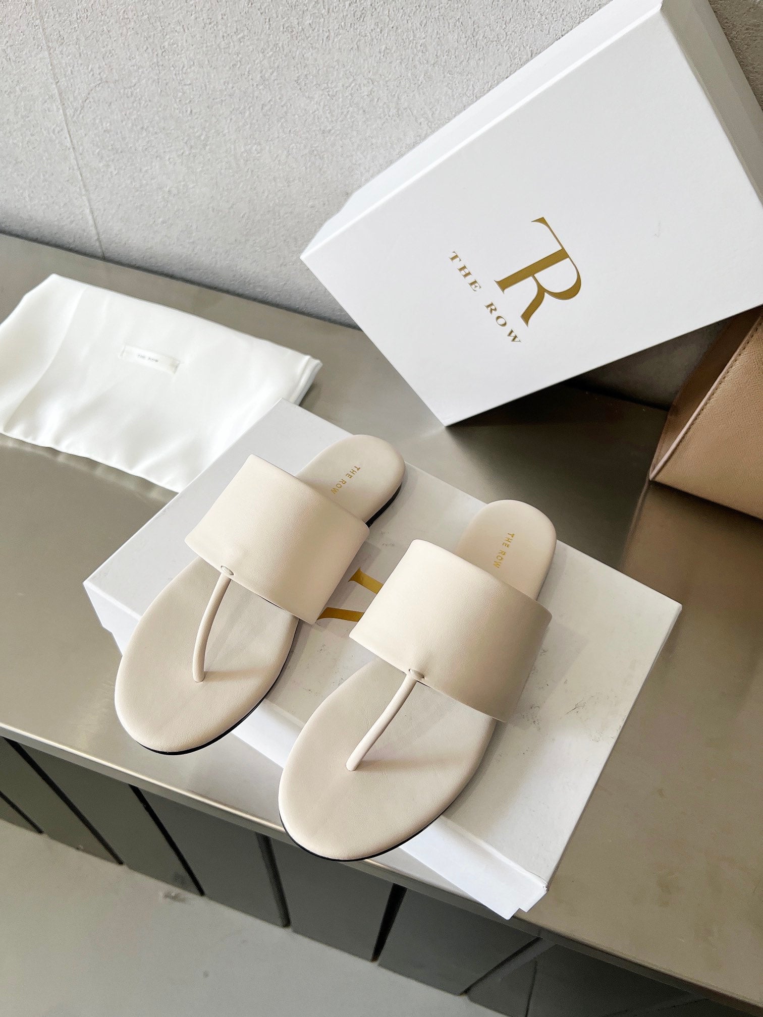 THE ROW 26S FLAT THONG SANDALS IN WHITE CALFSKIN