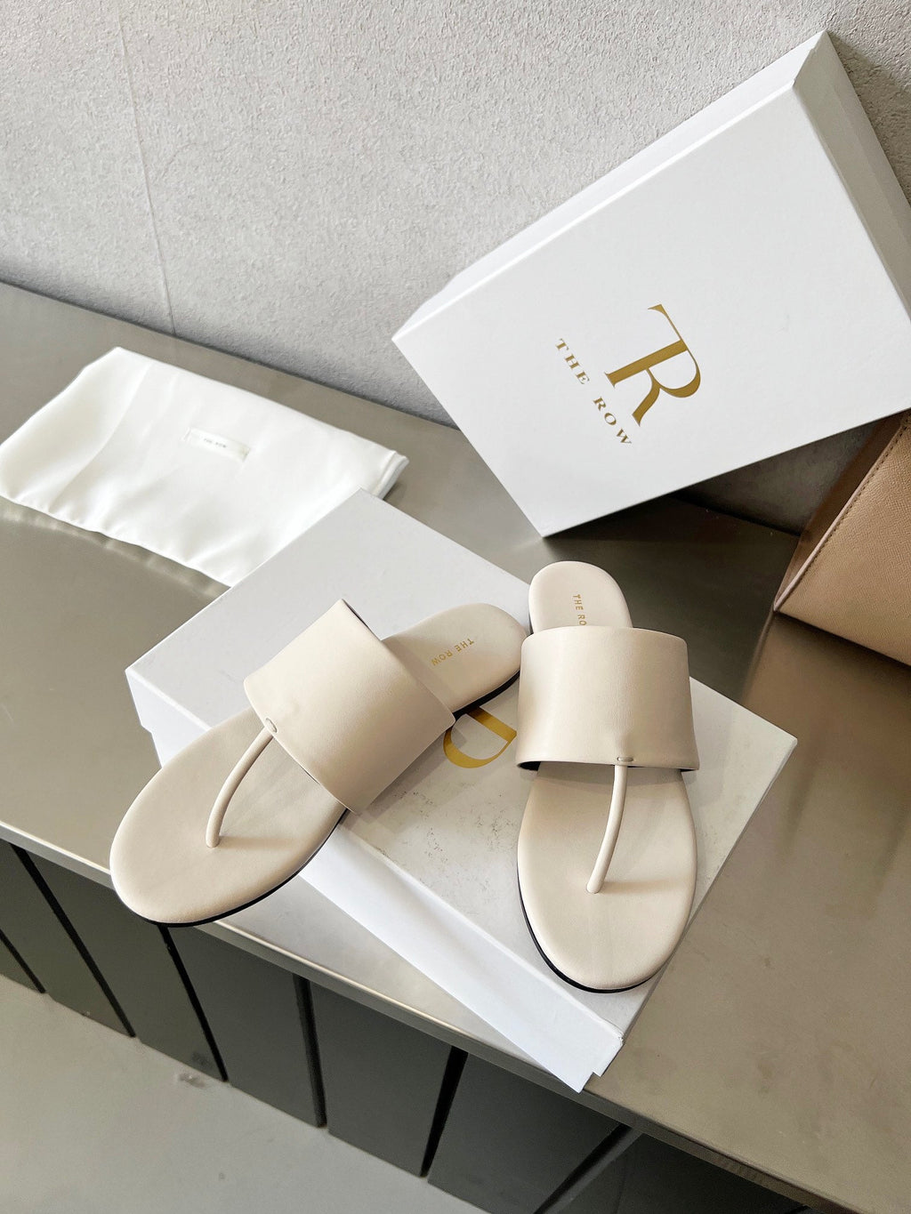 THE ROW 26S FLAT THONG SANDALS IN WHITE CALFSKIN