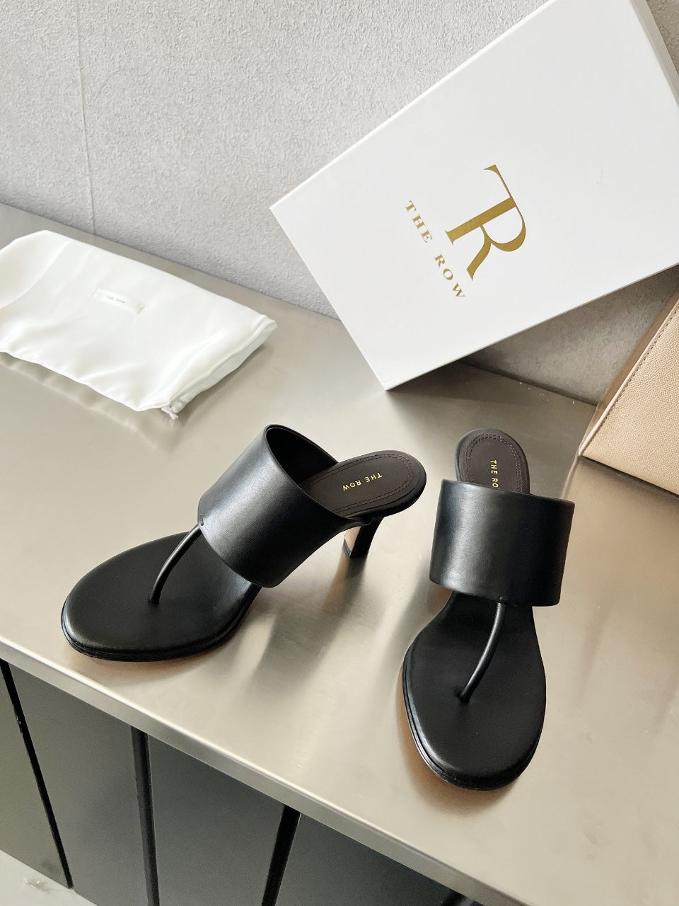 THE ROW 26S HEELED THONG MULES 60MM IN BLACK CALFSKIN