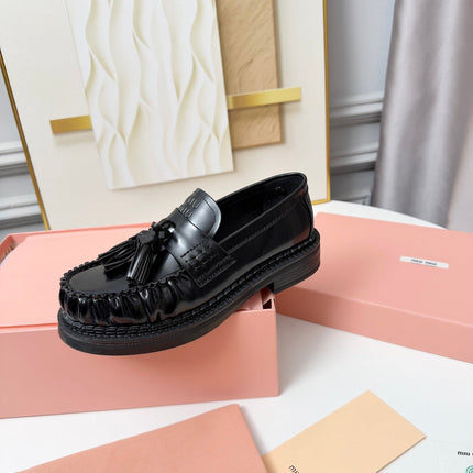 MIUMIU 26S TASSEL LOAFERS IN BLACK CALFSKIN
