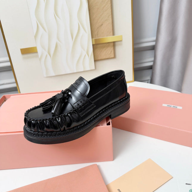 MIUMIU 26S TASSEL LOAFERS IN BLACK CALFSKIN