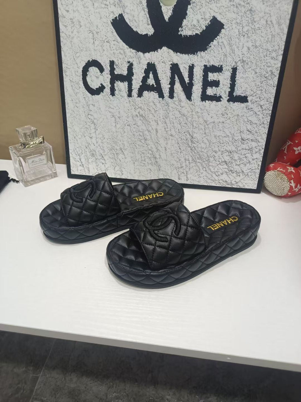 CHANEL 26S QUILTED SLIDE SANDALS IN BLACK CALFSKIN