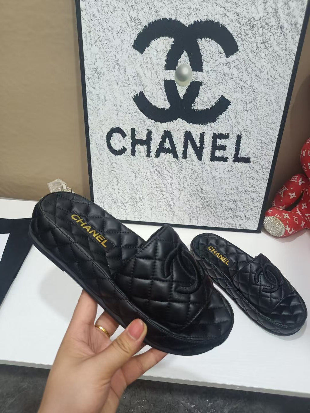 CHANEL 26S QUILTED SLIDE SANDALS IN BLACK CALFSKIN