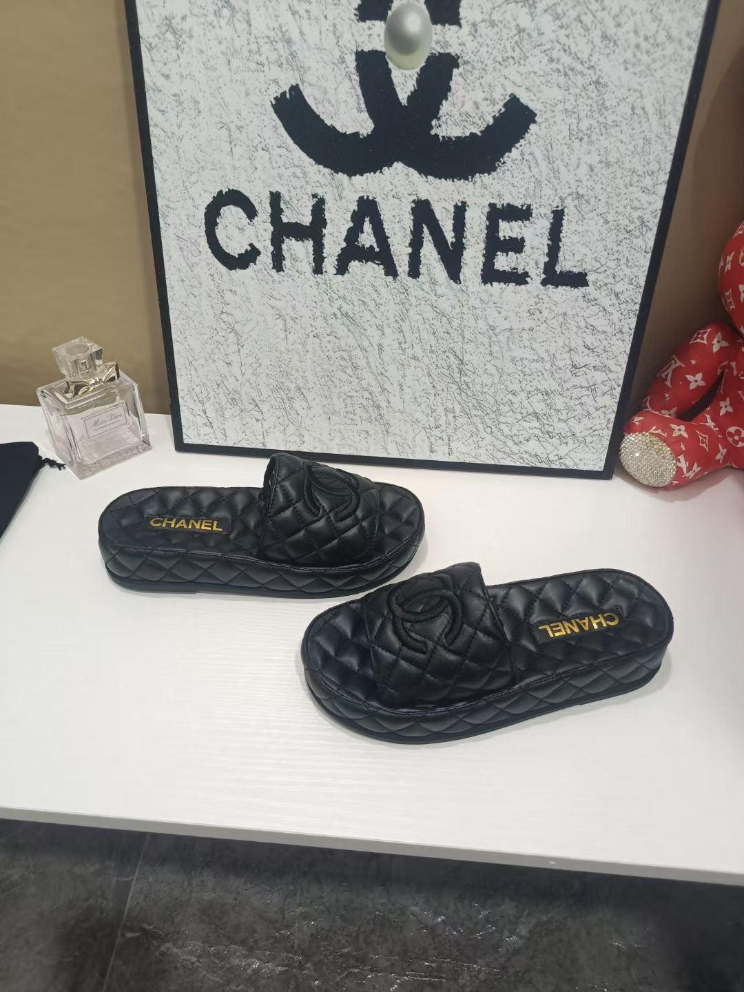 CHANEL 26S QUILTED SLIDE SANDALS IN BLACK CALFSKIN