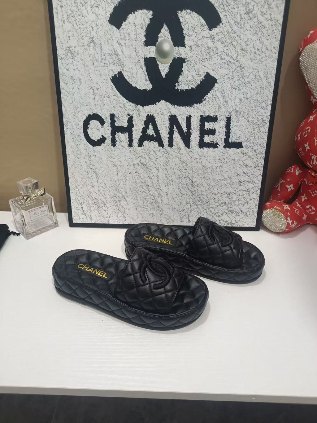 CHANEL 26S QUILTED SLIDE SANDALS IN BLACK CALFSKIN