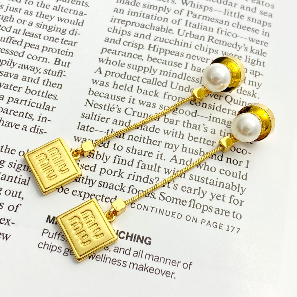 MIUMIU 26S PEARL BAR DROP LOGO EARRINGS IN GOLD TONE METAL 629846