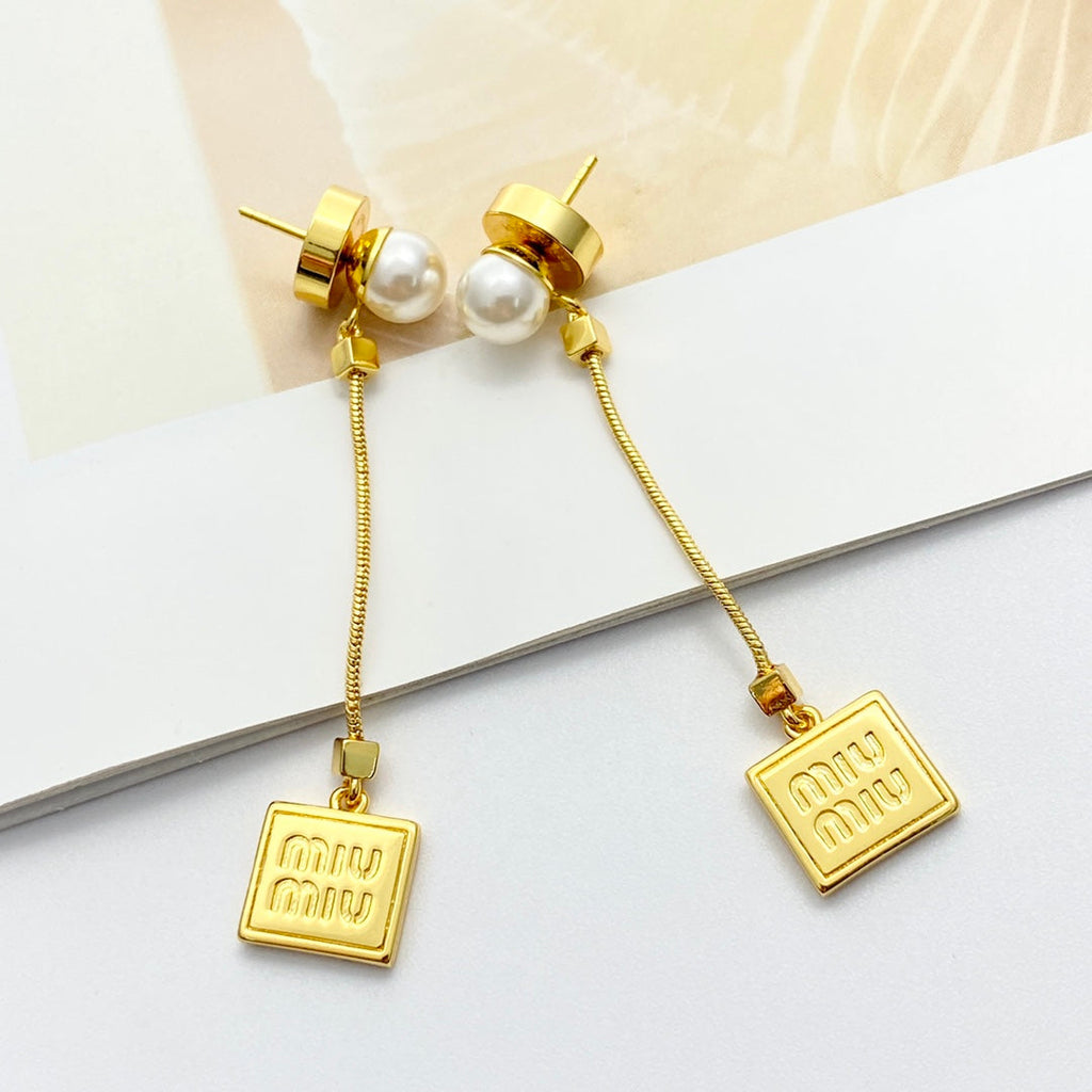 MIUMIU 26S PEARL BAR DROP LOGO EARRINGS IN GOLD TONE METAL 629846