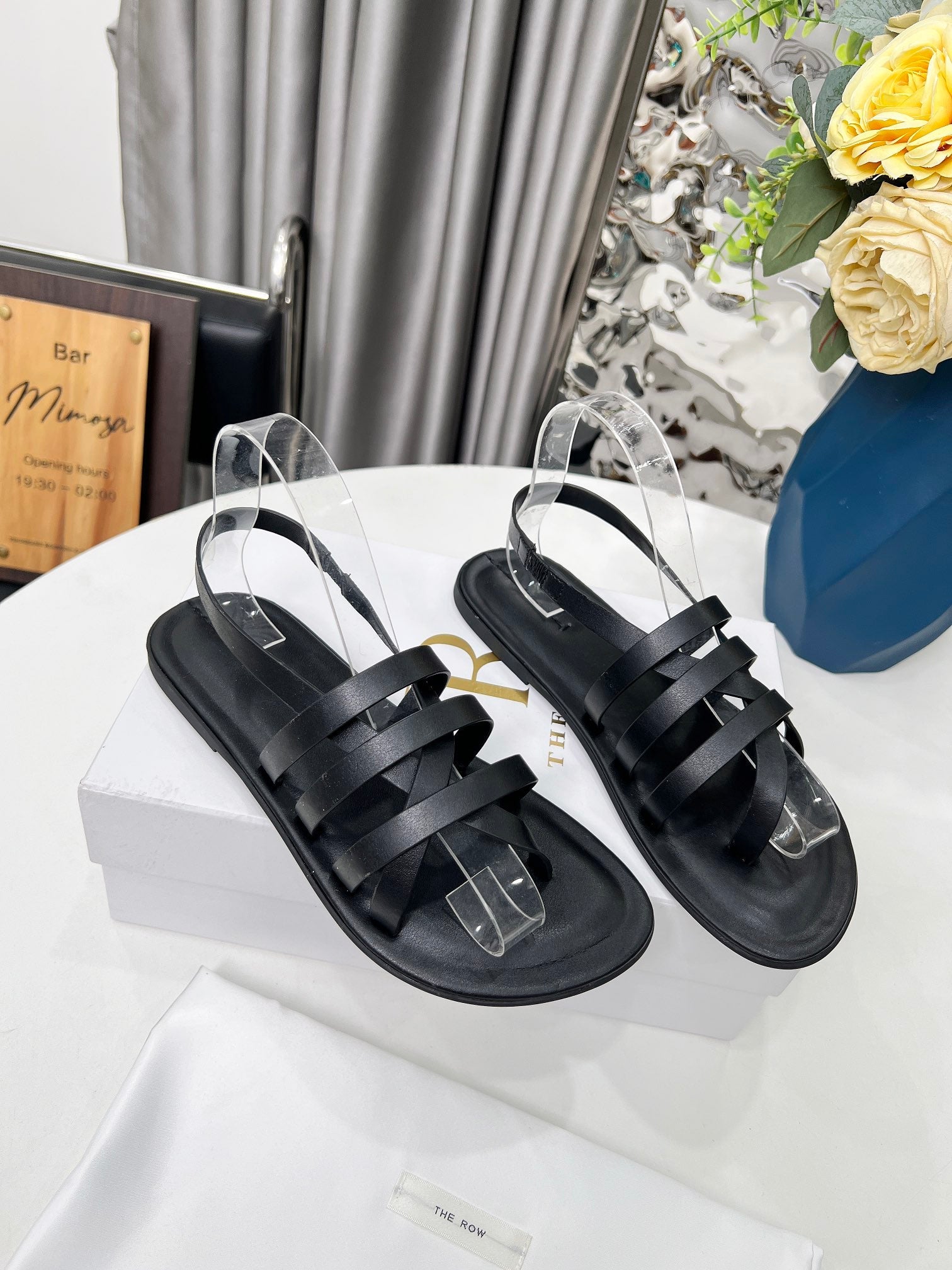 THE ROW 26S MINIMAL STRAPPY FLAT SANDALS IN BLACK CALFSKIN
