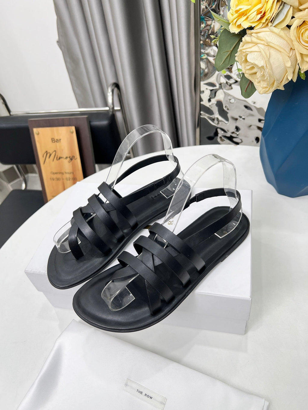 THE ROW 26S MINIMAL STRAPPY FLAT SANDALS IN BLACK CALFSKIN