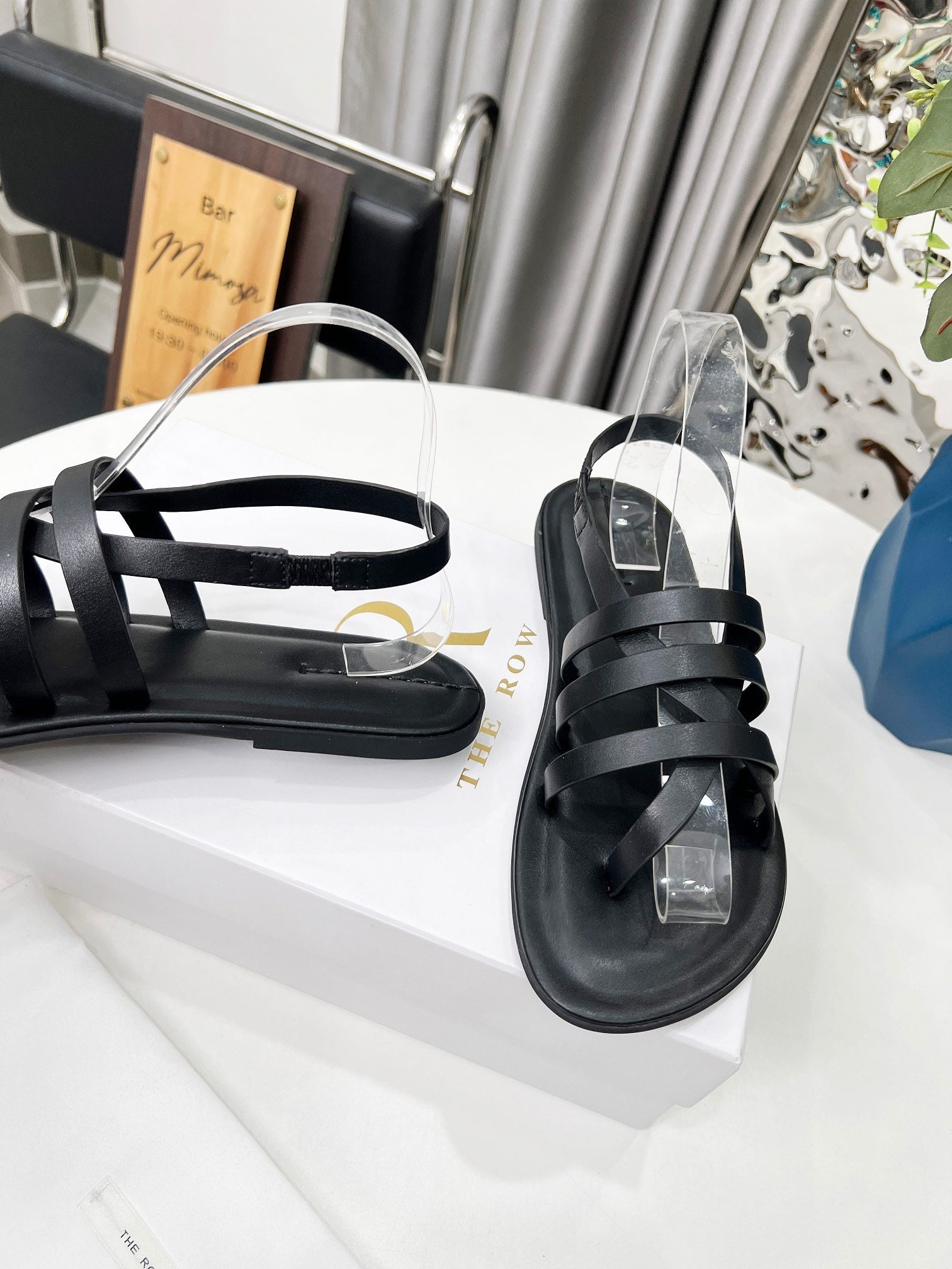 THE ROW 26S MINIMAL STRAPPY FLAT SANDALS IN BLACK CALFSKIN