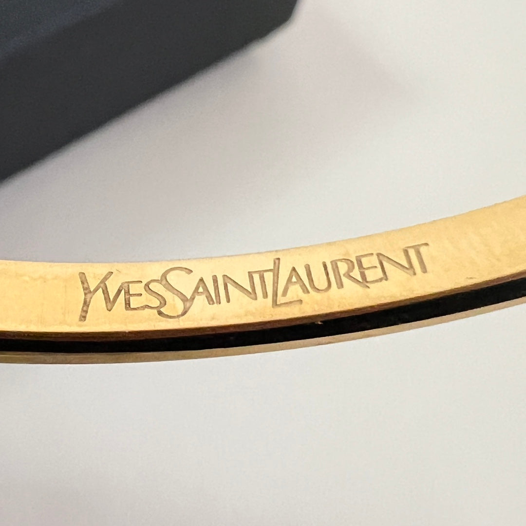 YSL 26S ENGRAVED LOGO BANGLE BRACELET IN GOLD TONE METAL 633272