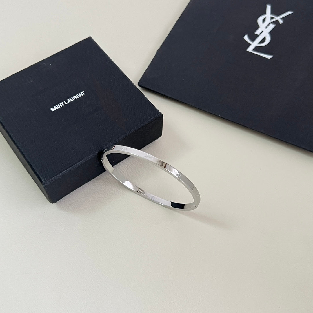 YSL 26S ENGRAVED LOGO BANGLE BRACELET IN SILVER TONE METAL 633273