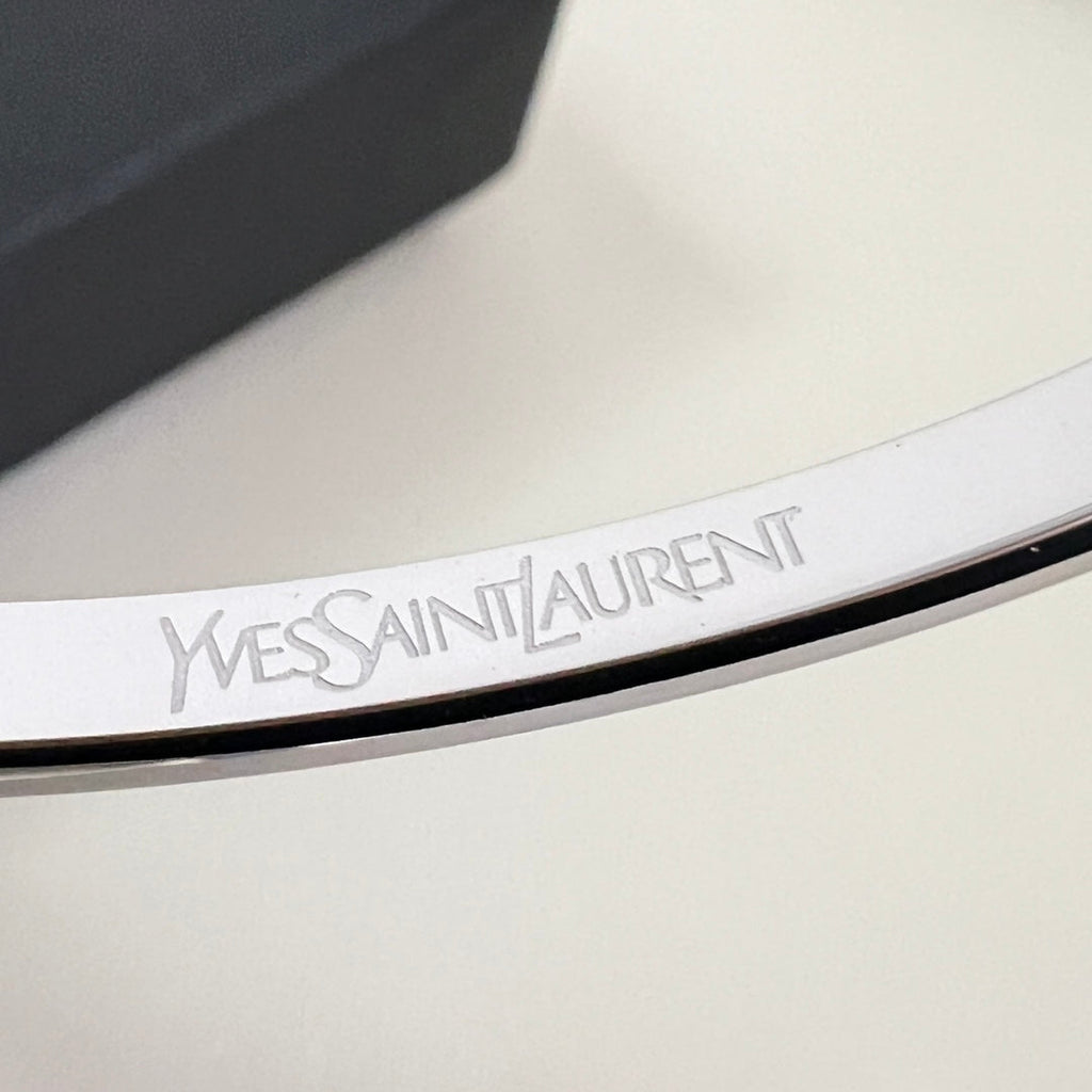 YSL 26S ENGRAVED LOGO BANGLE BRACELET IN SILVER TONE METAL 633273