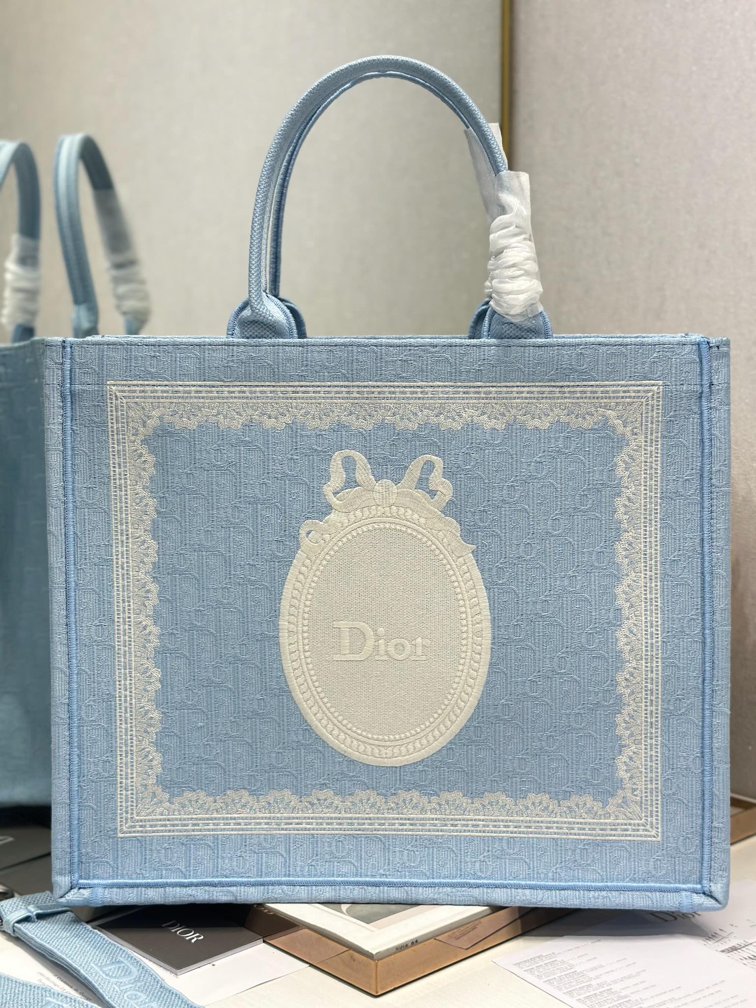 DIOR 26S BOOK TOTE BAG 42 IN BLUE AND WHITE LACE BAYADERE FABRIC