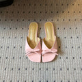 DIOR 26S OBLIQUE BOW MULE IN LIGHT PINK CALFSKIN
