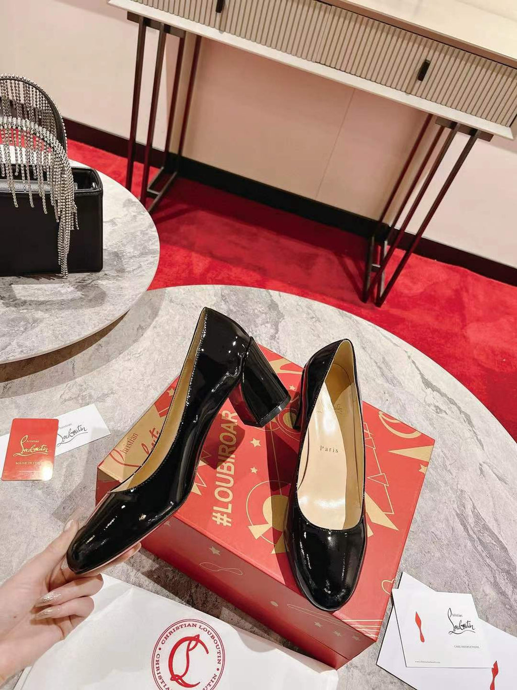 LOUBI DÉCOLLETÉ PUMPS IN BLACK CALFSKIN