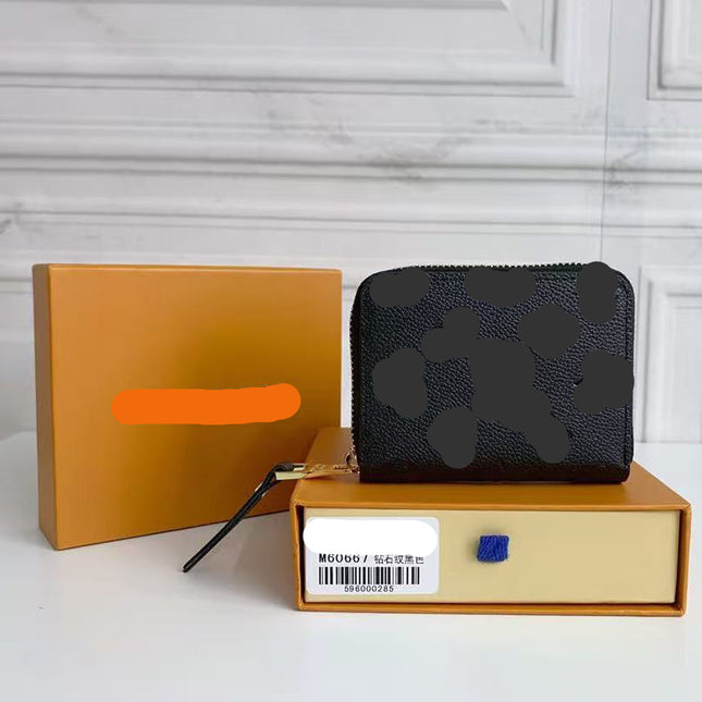 26S ZIPPY COIN PURSE IN BLACK MONOGRAM CALFSKIN