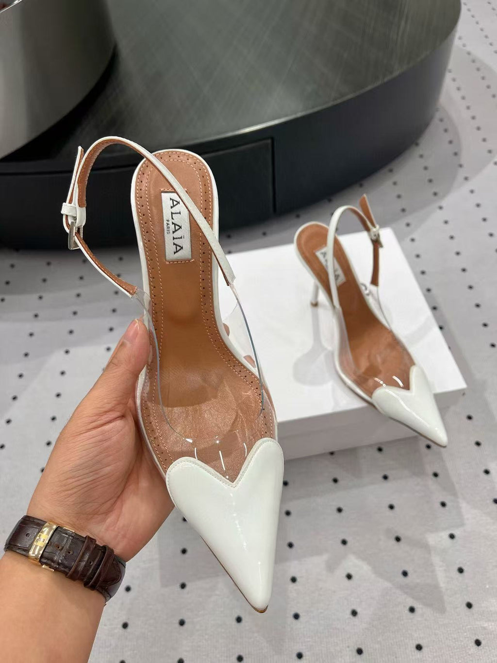 ALAIA HIGH 9 CM SLINGBACK IN WHITE PATENT CALFSKIN AND FILM