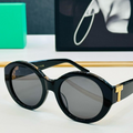 ROUND FRAME SUNGLASSES IN BLACK GLOSSY ACETATE WITH GOLD "T" ACCENT