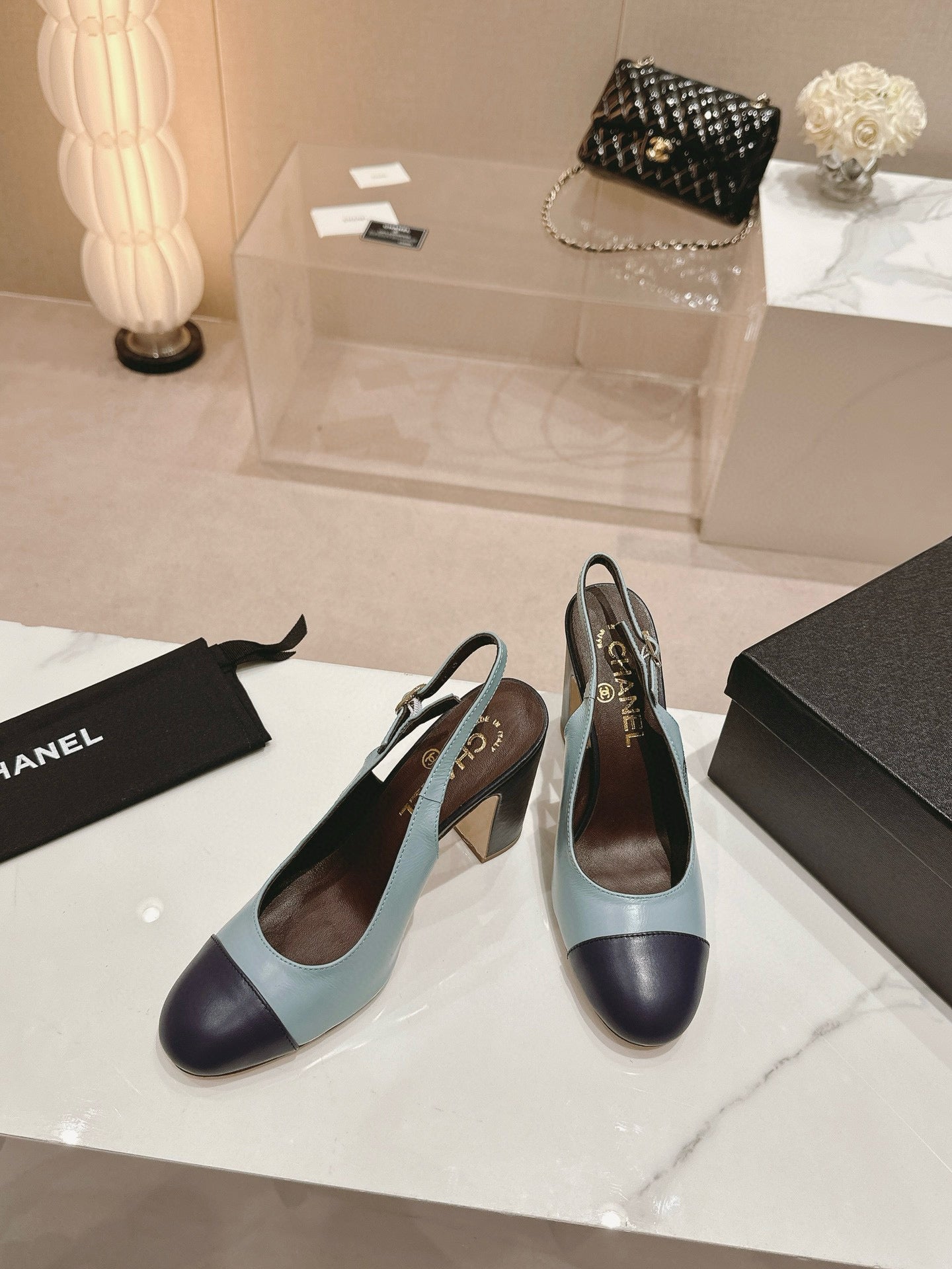 CC SLINGBACK PUMPS IN BLUE AND BLACK CALFSKIN