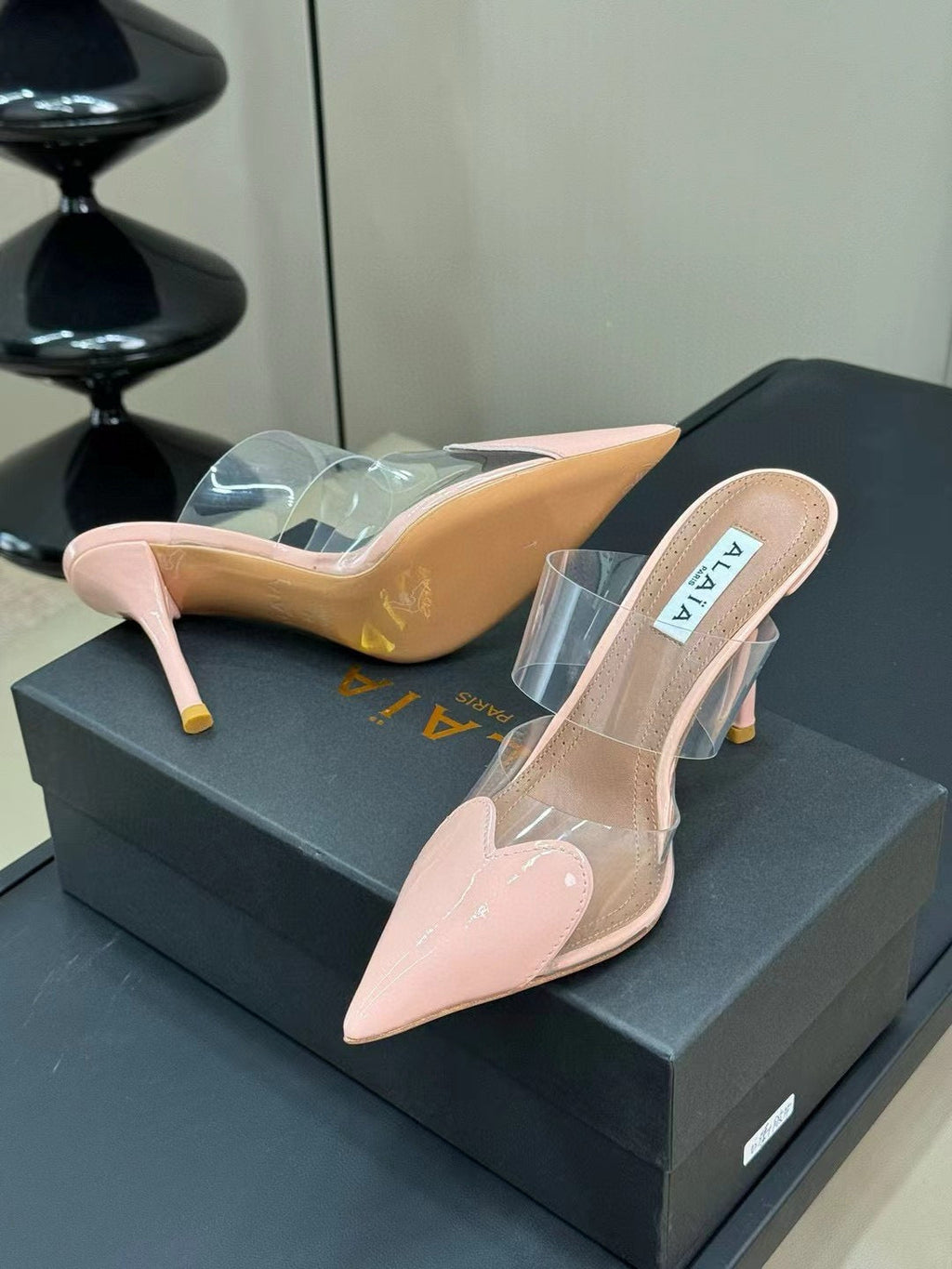 ALAIA HIGH MULES IN LIGHT PINK PATENT CALFSKIN AND FILM