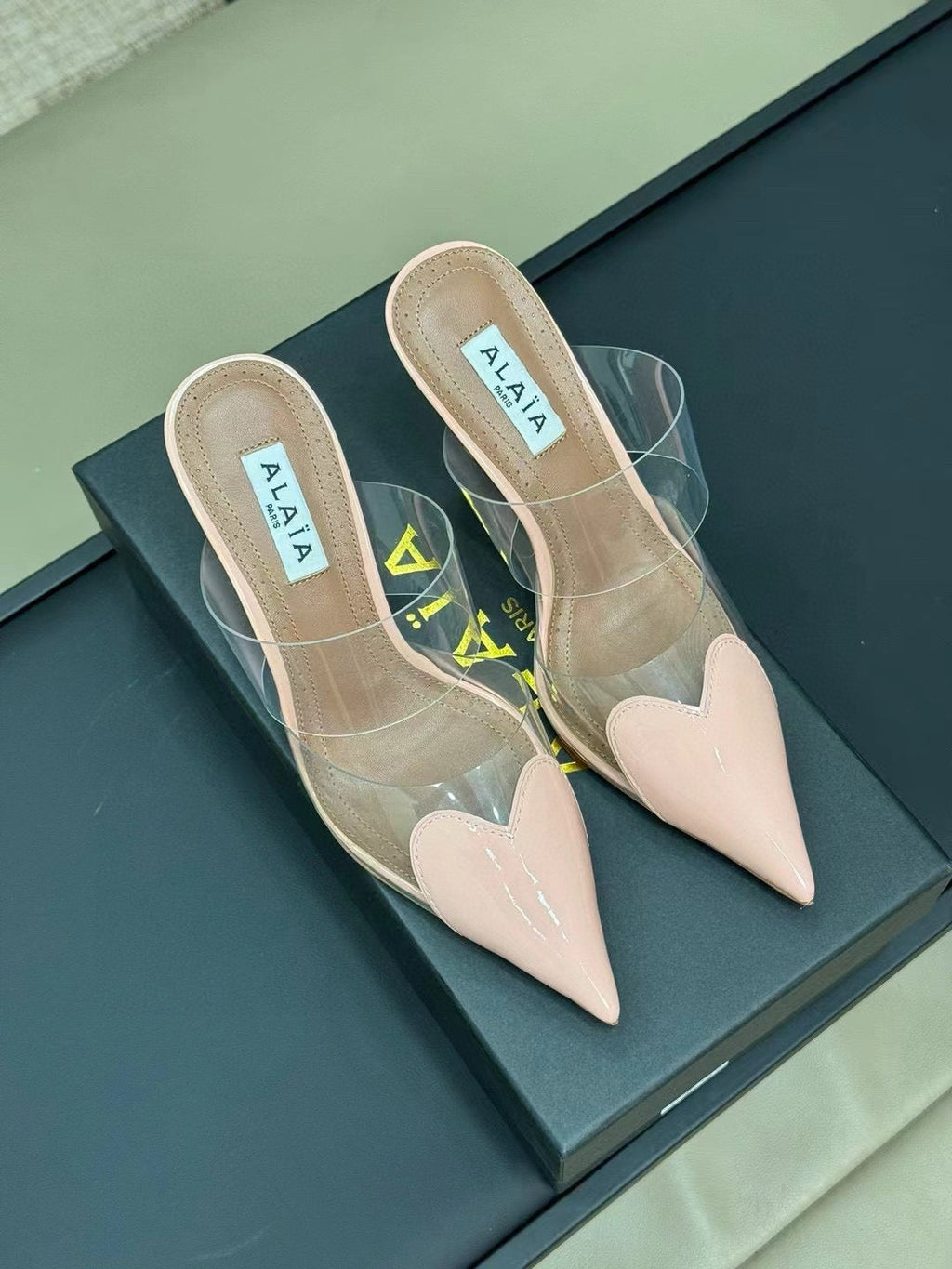 ALAIA HIGH MULES IN LIGHT PINK PATENT CALFSKIN AND FILM