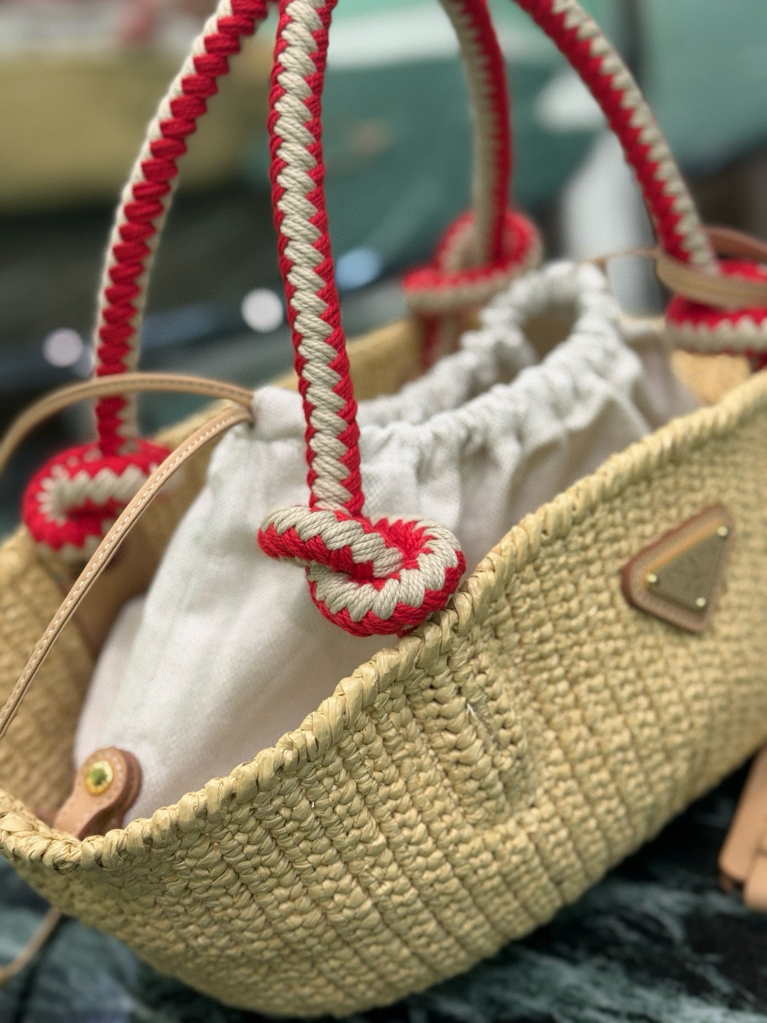 PRA HANDBAG 26 IN BEIGE RAFFIA AND RED WOVEN HANDLES