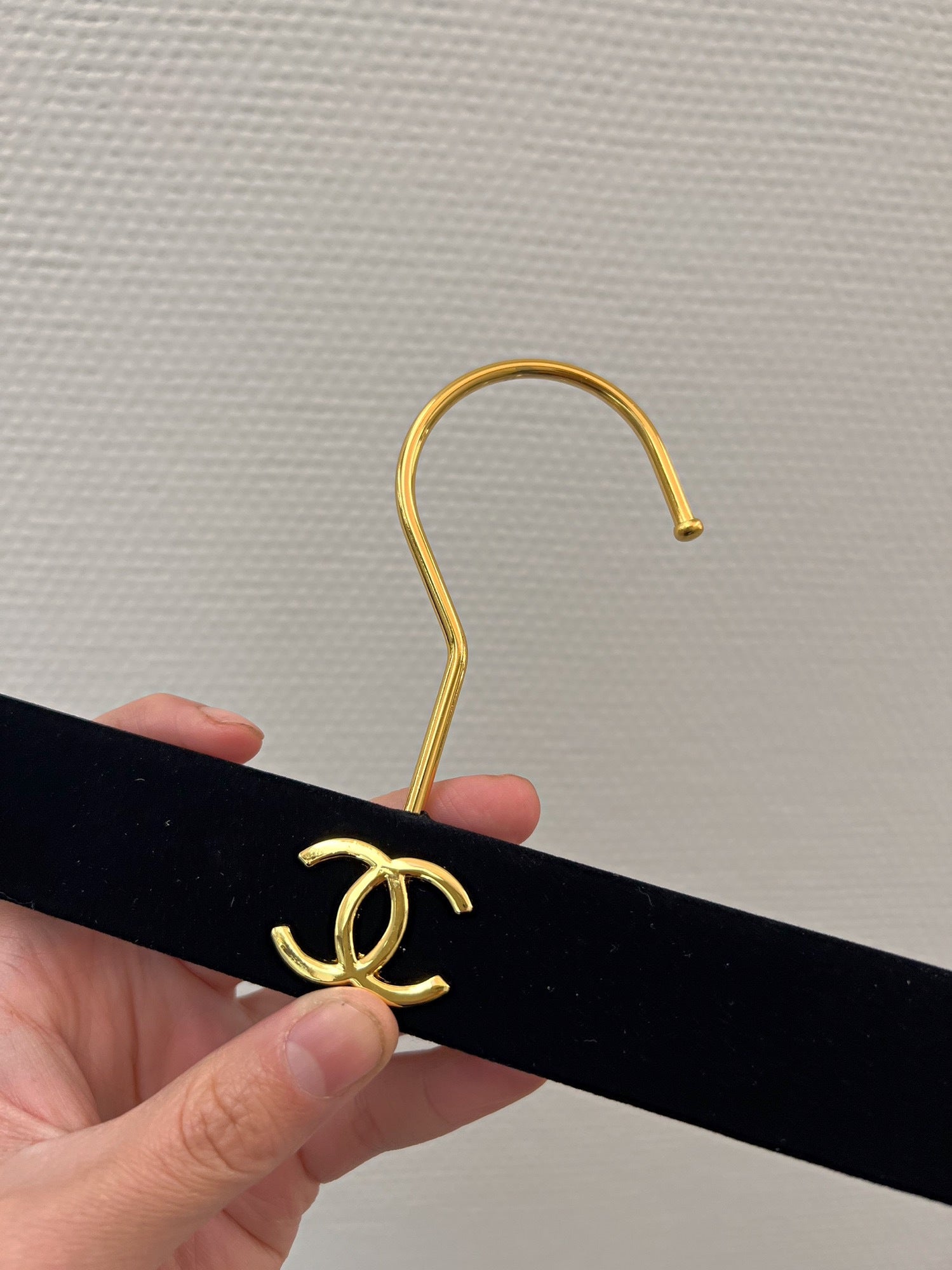 Chanel hanger's in black velvet and gold hardware