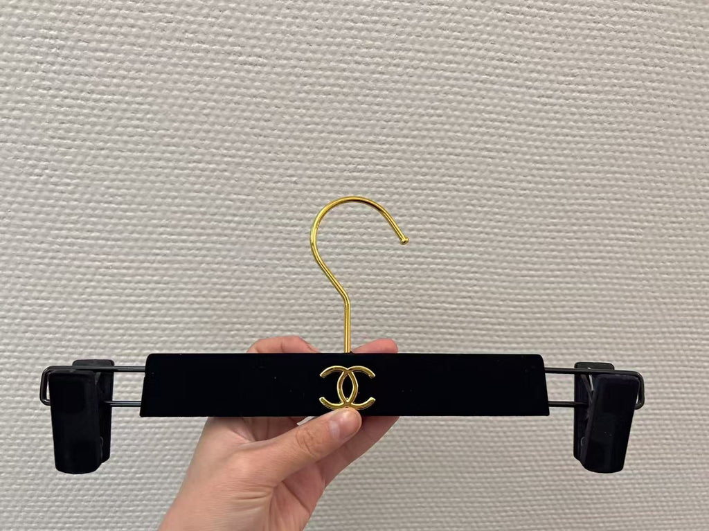 Chanel hanger's in black velvet and gold hardware