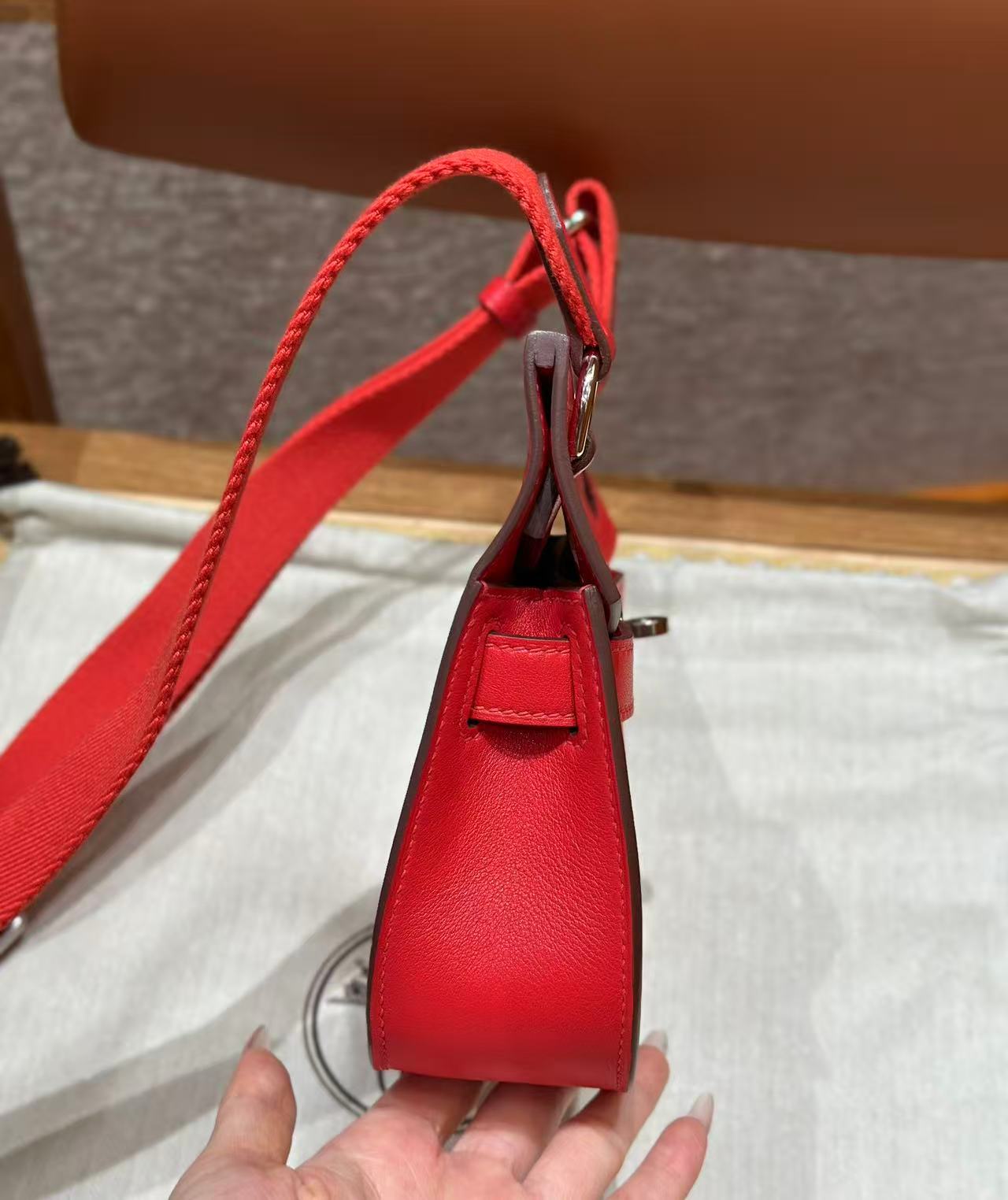 HM MINI JYPSIERE BAG IN RED SWIFT LEATHER SILVER HARDWARE.