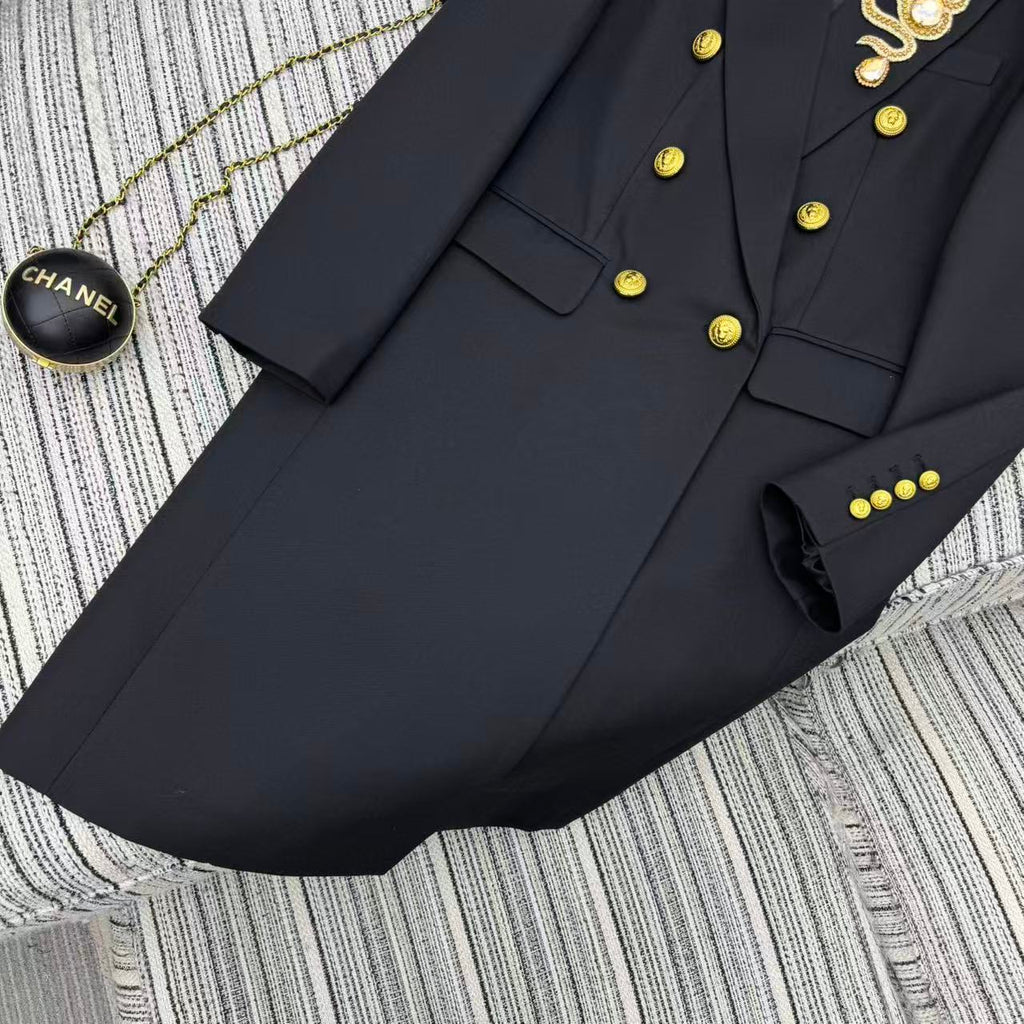 LONG COAT IN BLACK WITH GOLD BUTTONS AND A SNAKE BROOCH
