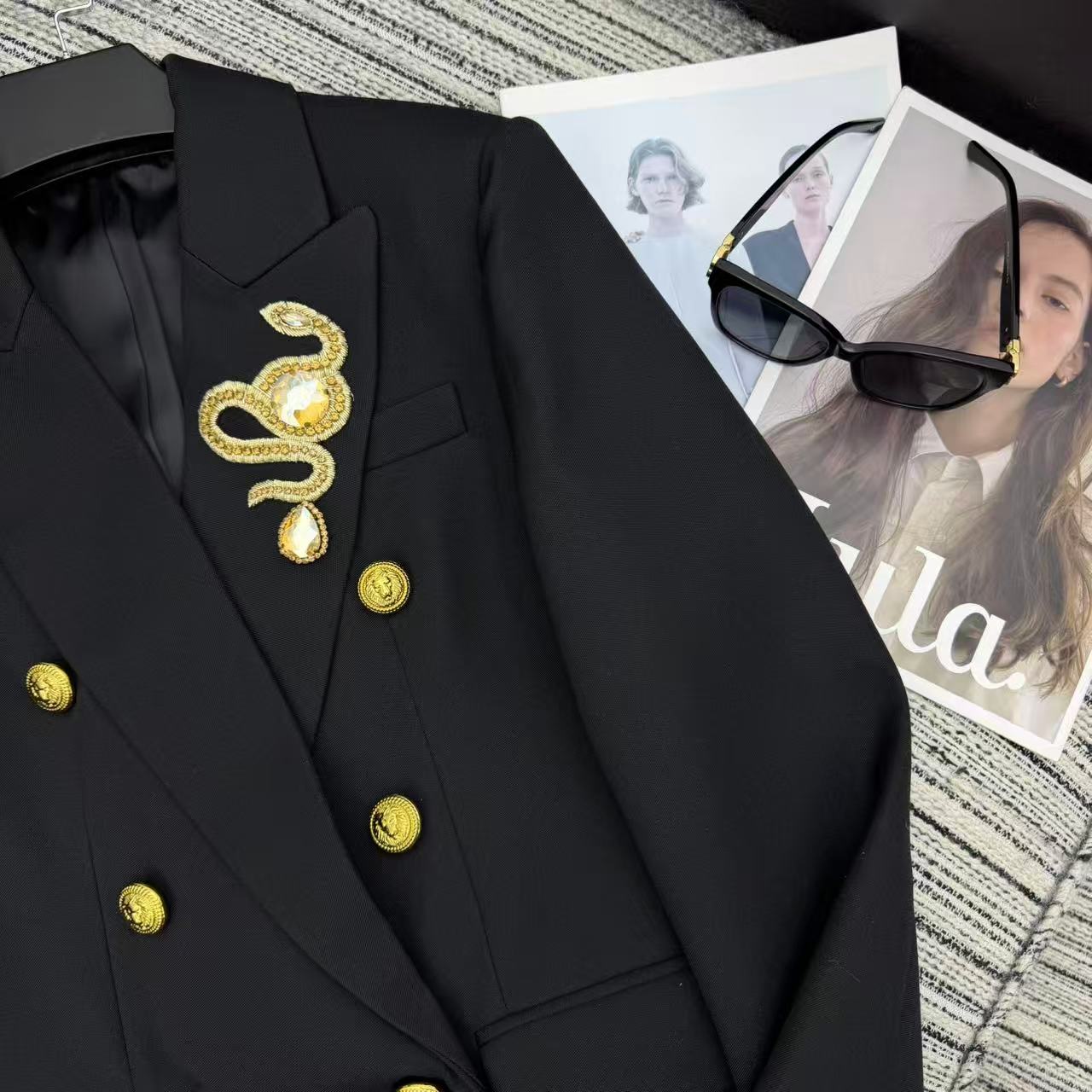 LONG COAT IN BLACK WITH GOLD BUTTONS AND A SNAKE BROOCH