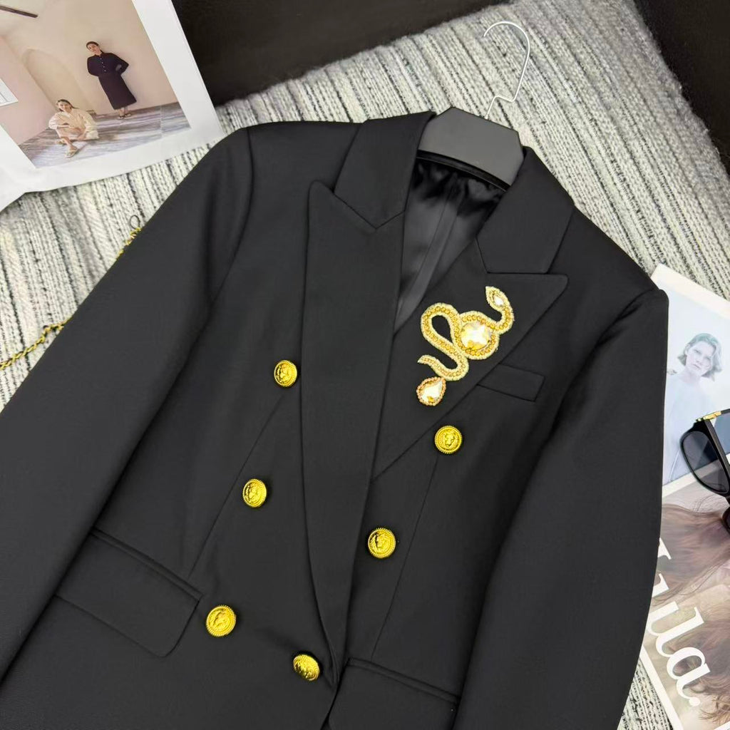 LONG COAT IN BLACK WITH GOLD BUTTONS AND A SNAKE BROOCH
