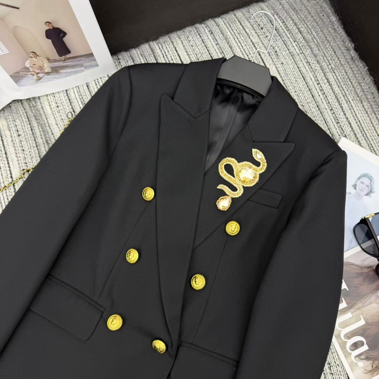 LONG COAT IN BLACK WITH GOLD BUTTONS AND A SNAKE BROOCH