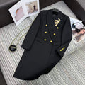LONG COAT IN BLACK WITH GOLD BUTTONS AND A SNAKE BROOCH