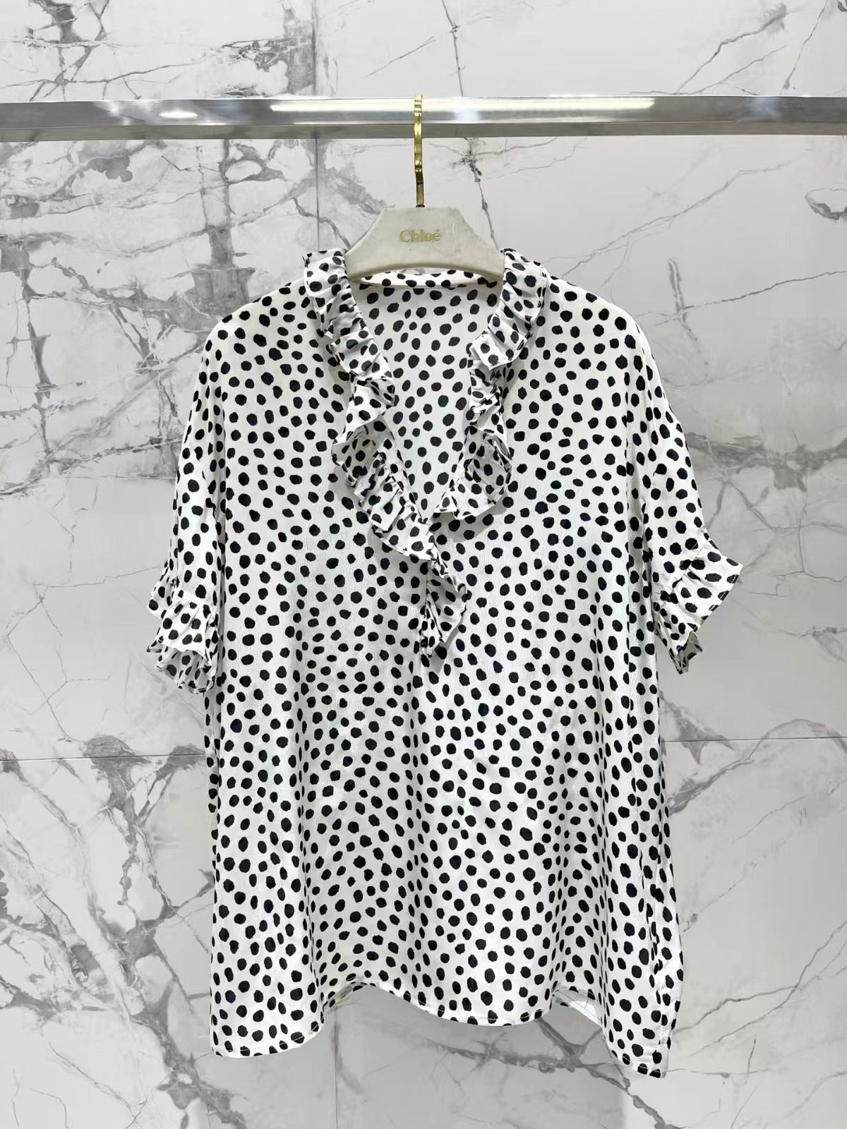 CHLOE RUFFLED BLOUSE IN BLACK AND WHITE DOT PATTERN