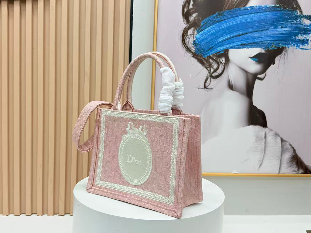 DIOR BOOK TOTE BAG 36 IN PINK COLORWAY WITH AN OVAL EMBROIDERED LOGO EMBLEM