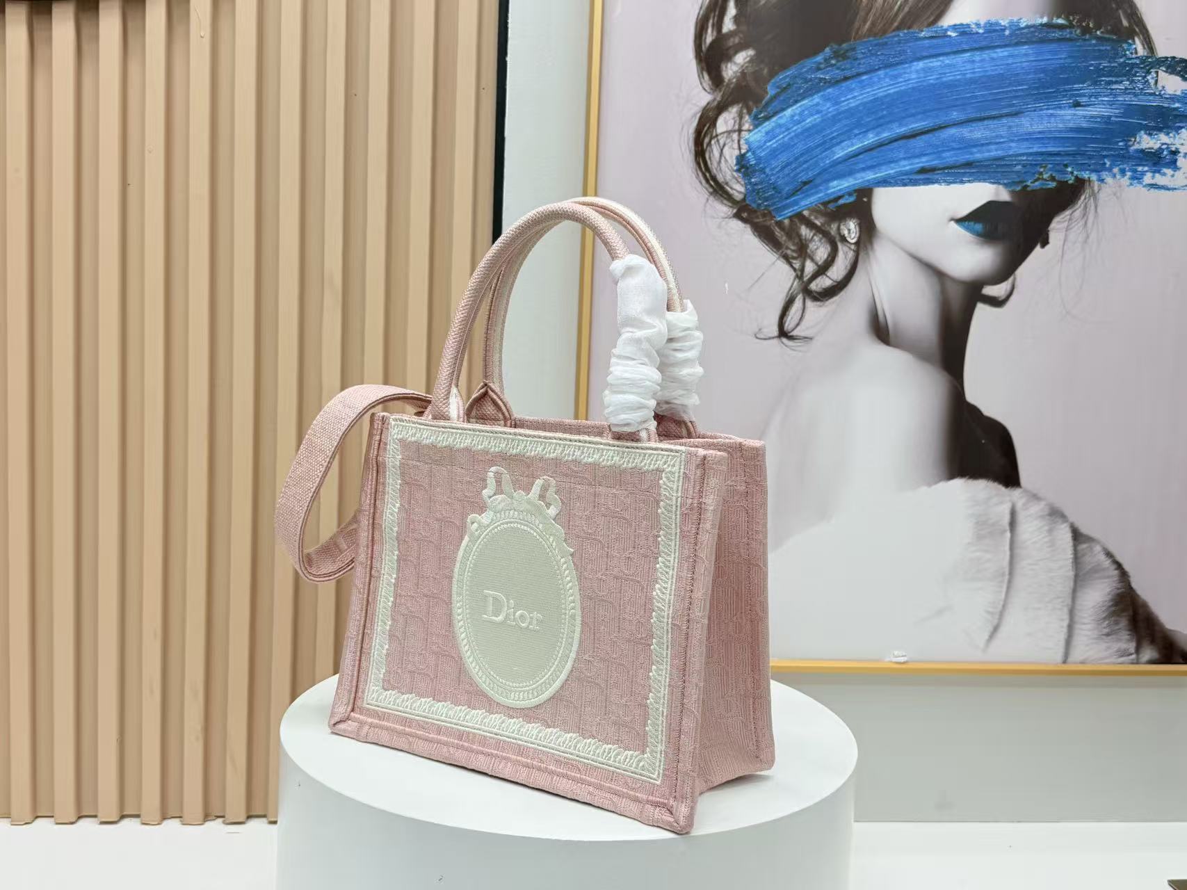 DIOR BOOK TOTE BAG 36 IN PINK COLORWAY WITH AN OVAL EMBROIDERED LOGO EMBLEM