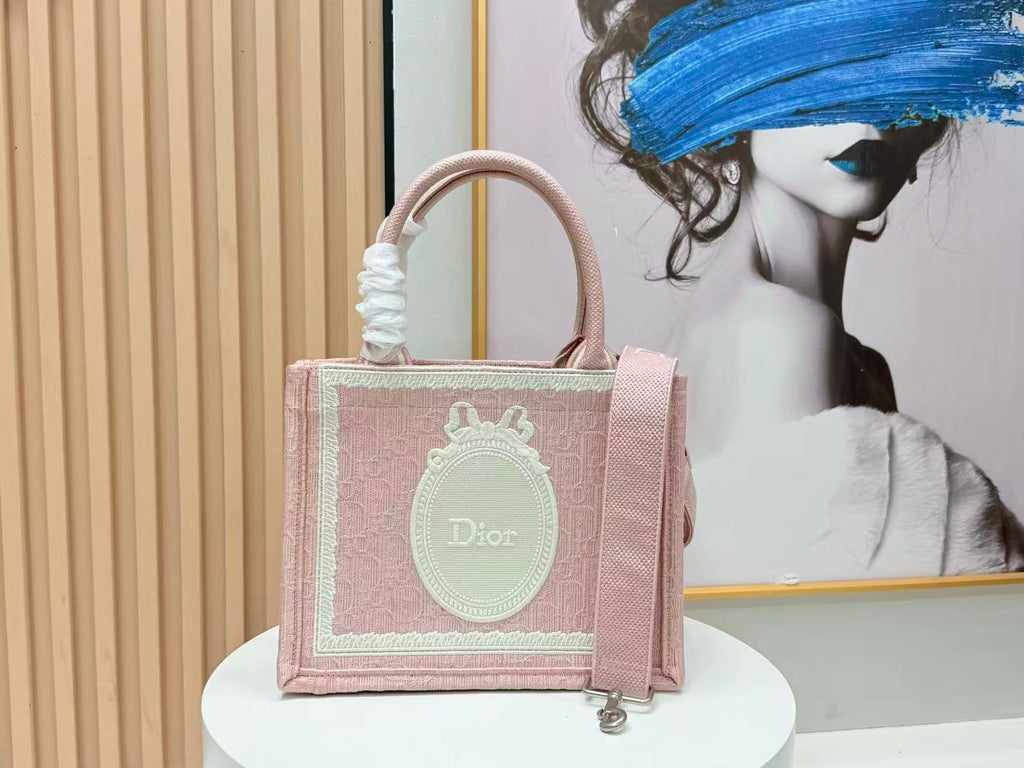 DIOR BOOK TOTE BAG 36 IN PINK COLORWAY WITH AN OVAL EMBROIDERED LOGO EMBLEM