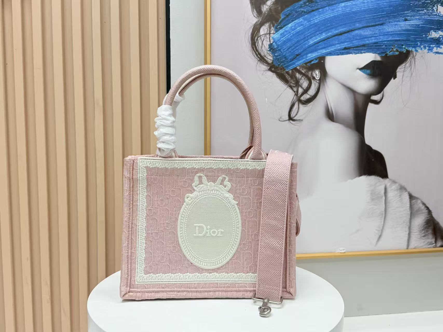 DIOR BOOK TOTE BAG 36 IN PINK COLORWAY WITH AN OVAL EMBROIDERED LOGO EMBLEM