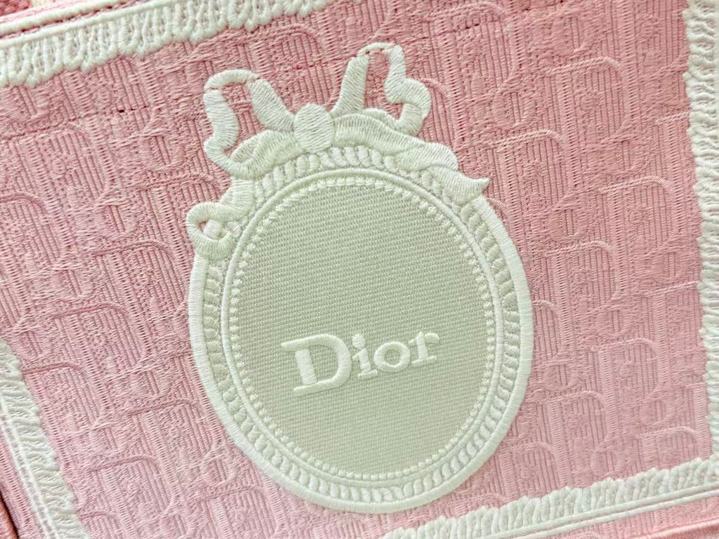 DIOR BOOK TOTE BAG 36 IN PINK COLORWAY WITH AN OVAL EMBROIDERED LOGO EMBLEM