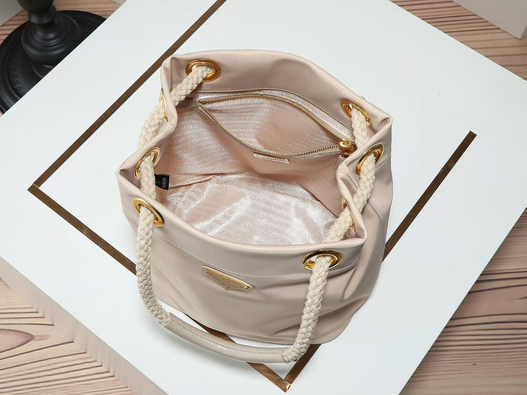 PRADA 26S BUCKET BAG IN BEIGE RENYLON