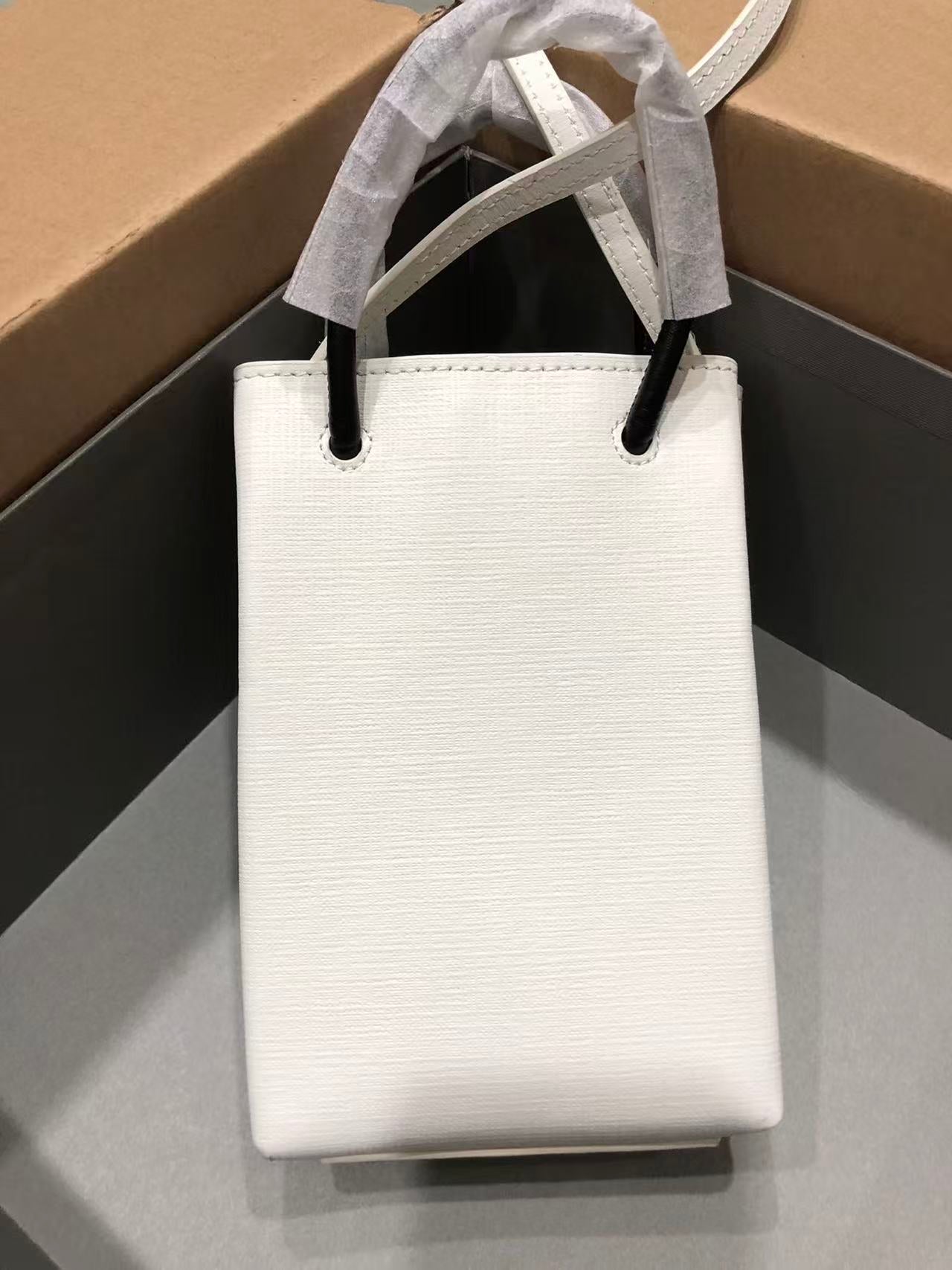 BALENCIAGA SHOPPING PHONE HOLDER 26S IN WHITE CAFLSKIN LEATHER