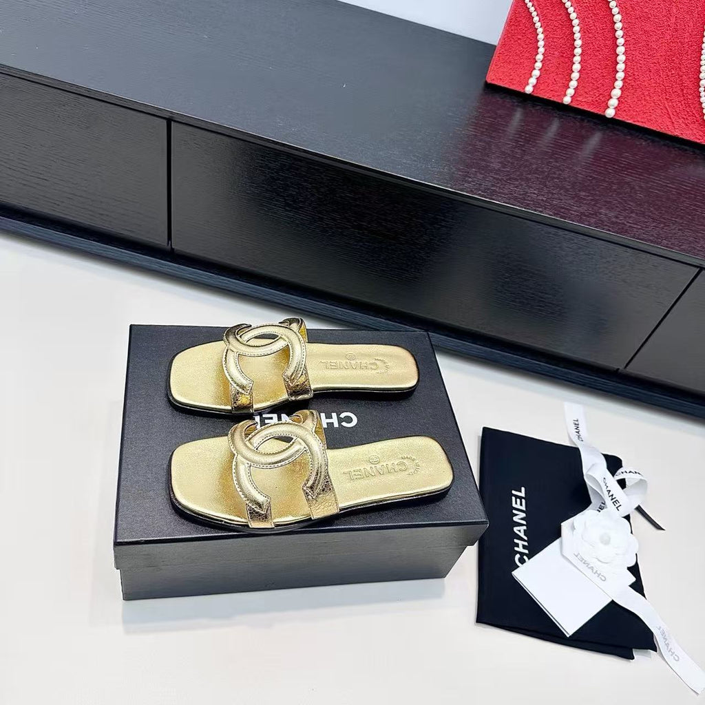 CHANEL CC LOGO MULES IN GOLD METALLIC CALFSKIN