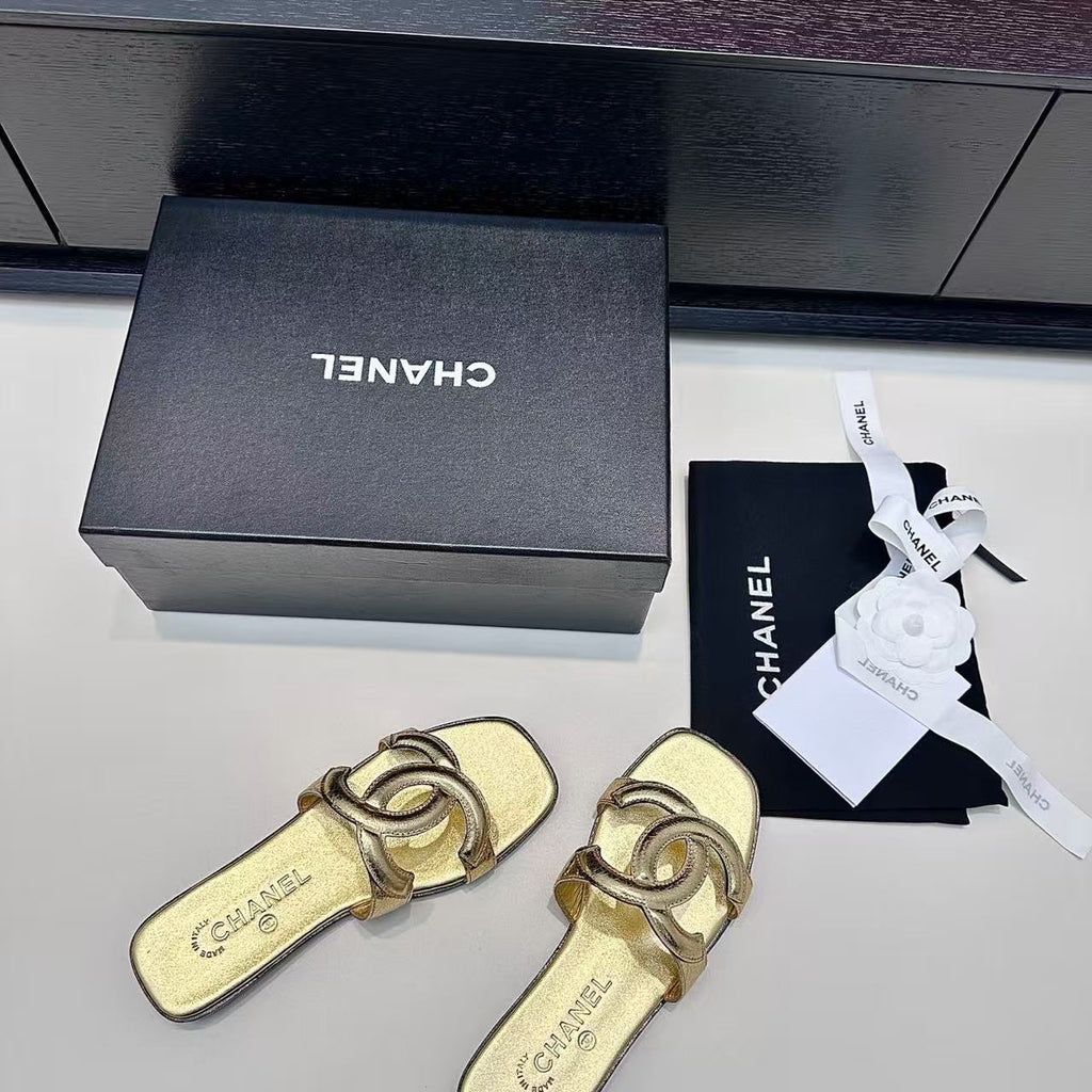 CHANEL CC LOGO MULES IN GOLD METALLIC CALFSKIN