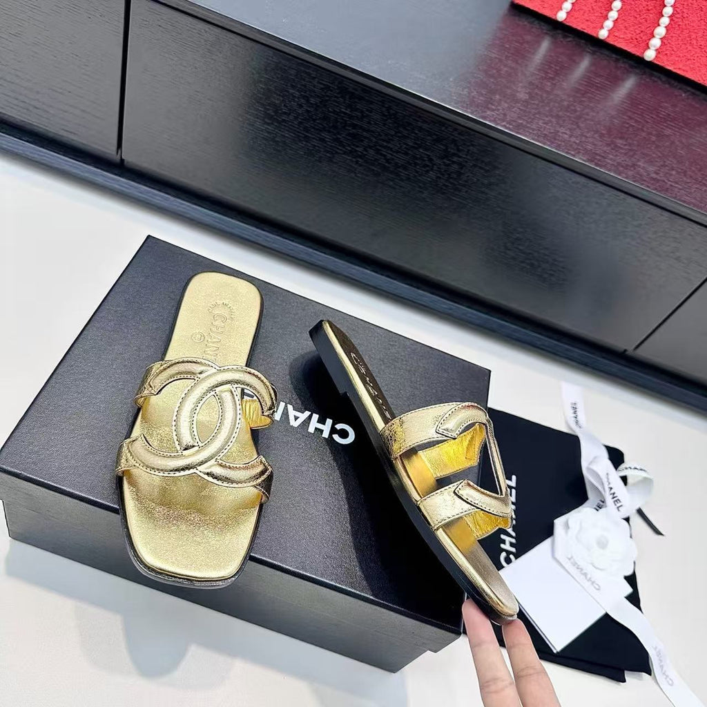 CHANEL CC LOGO MULES IN GOLD METALLIC CALFSKIN
