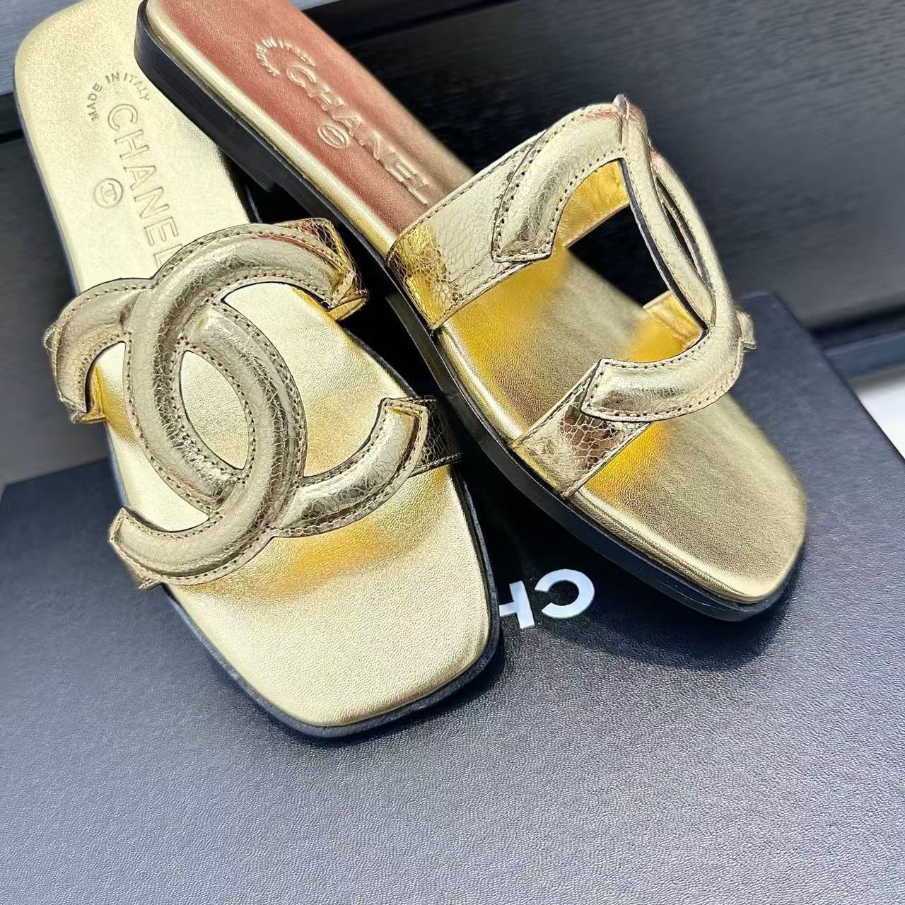 CHANEL CC LOGO MULES IN GOLD METALLIC CALFSKIN