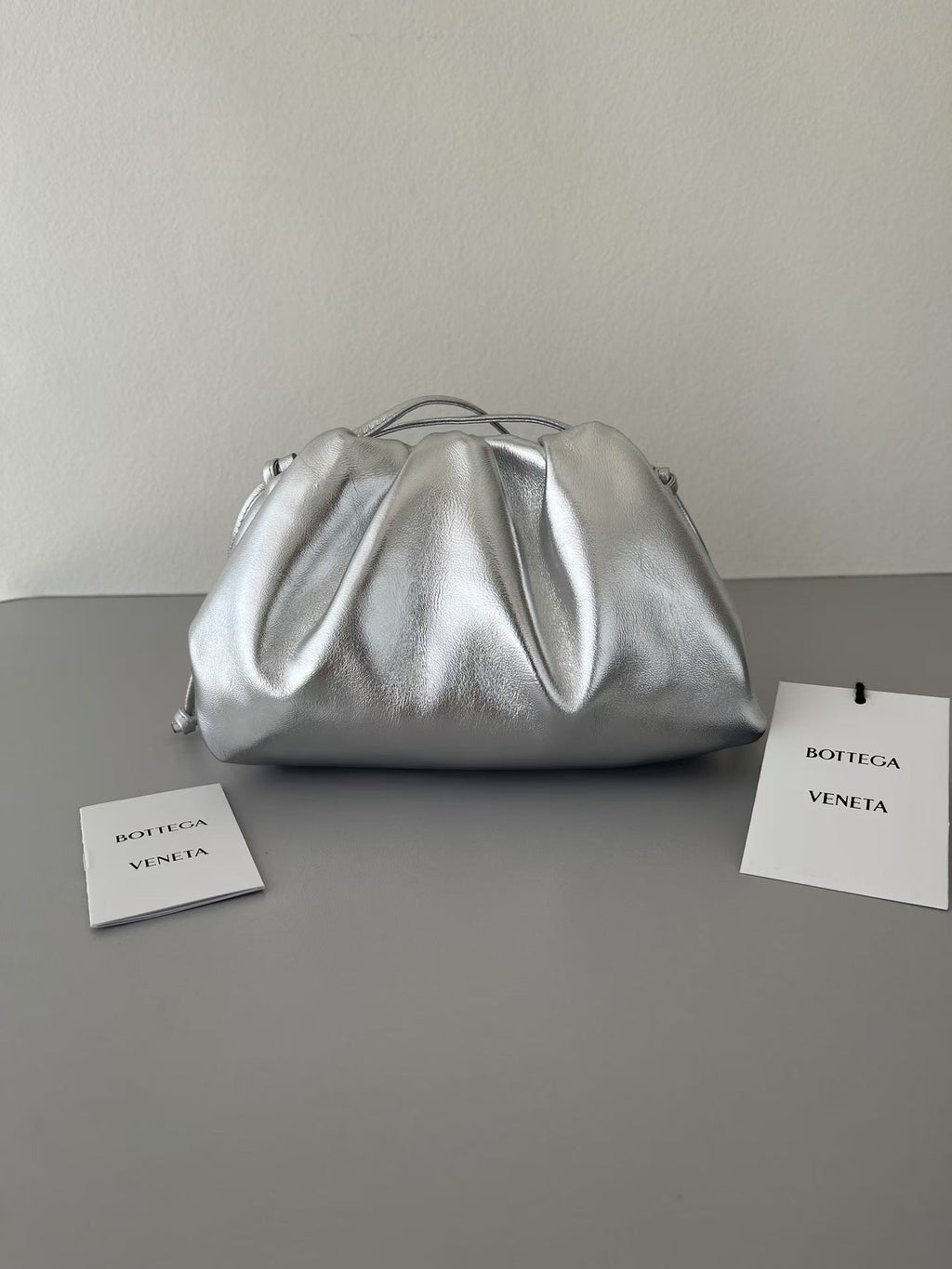 BOTTEGA VENETA 26S POUCH BAG IN SILVER METALLIC LEATHER