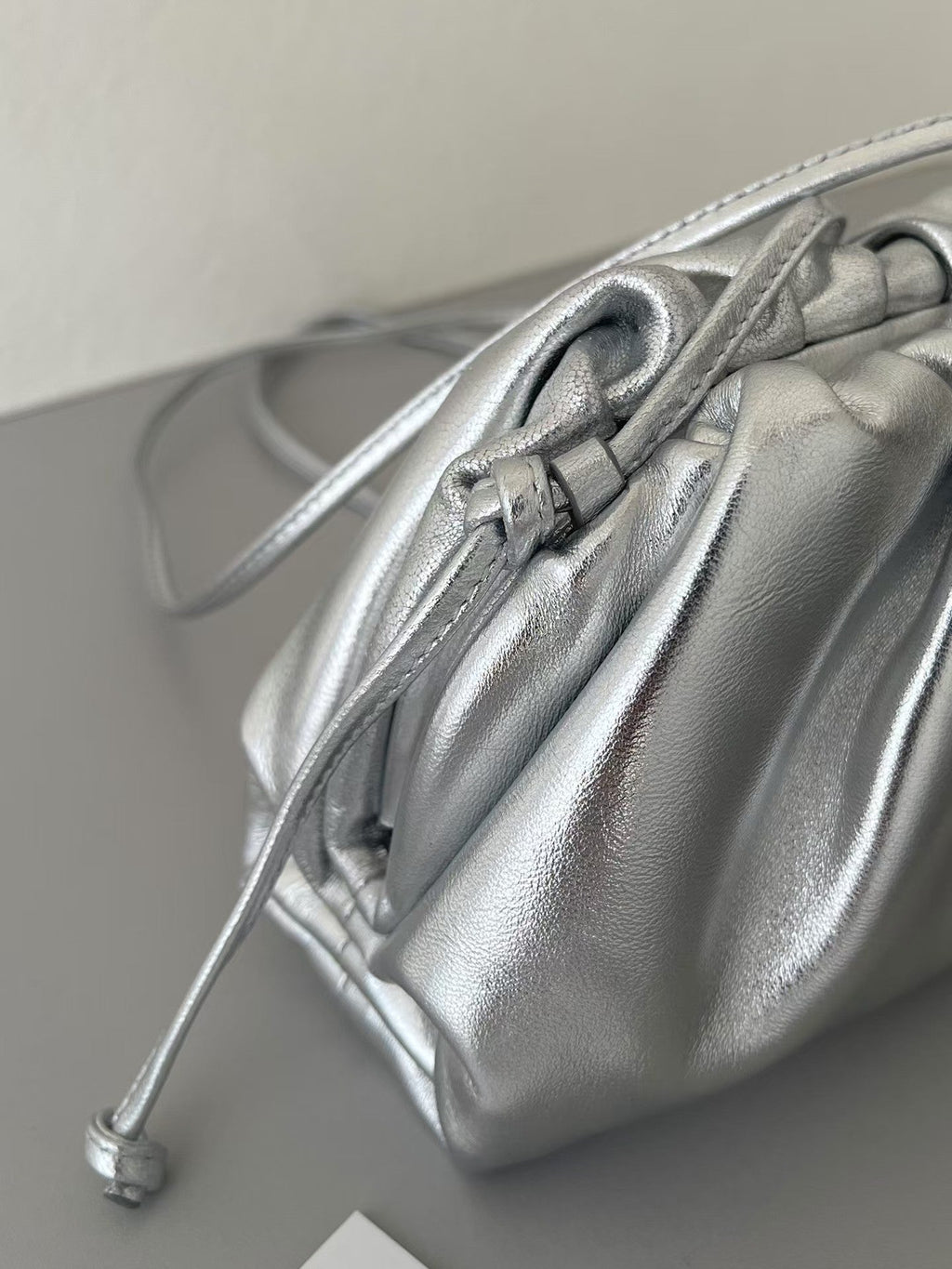 BOTTEGA VENETA 26S POUCH BAG IN SILVER METALLIC LEATHER