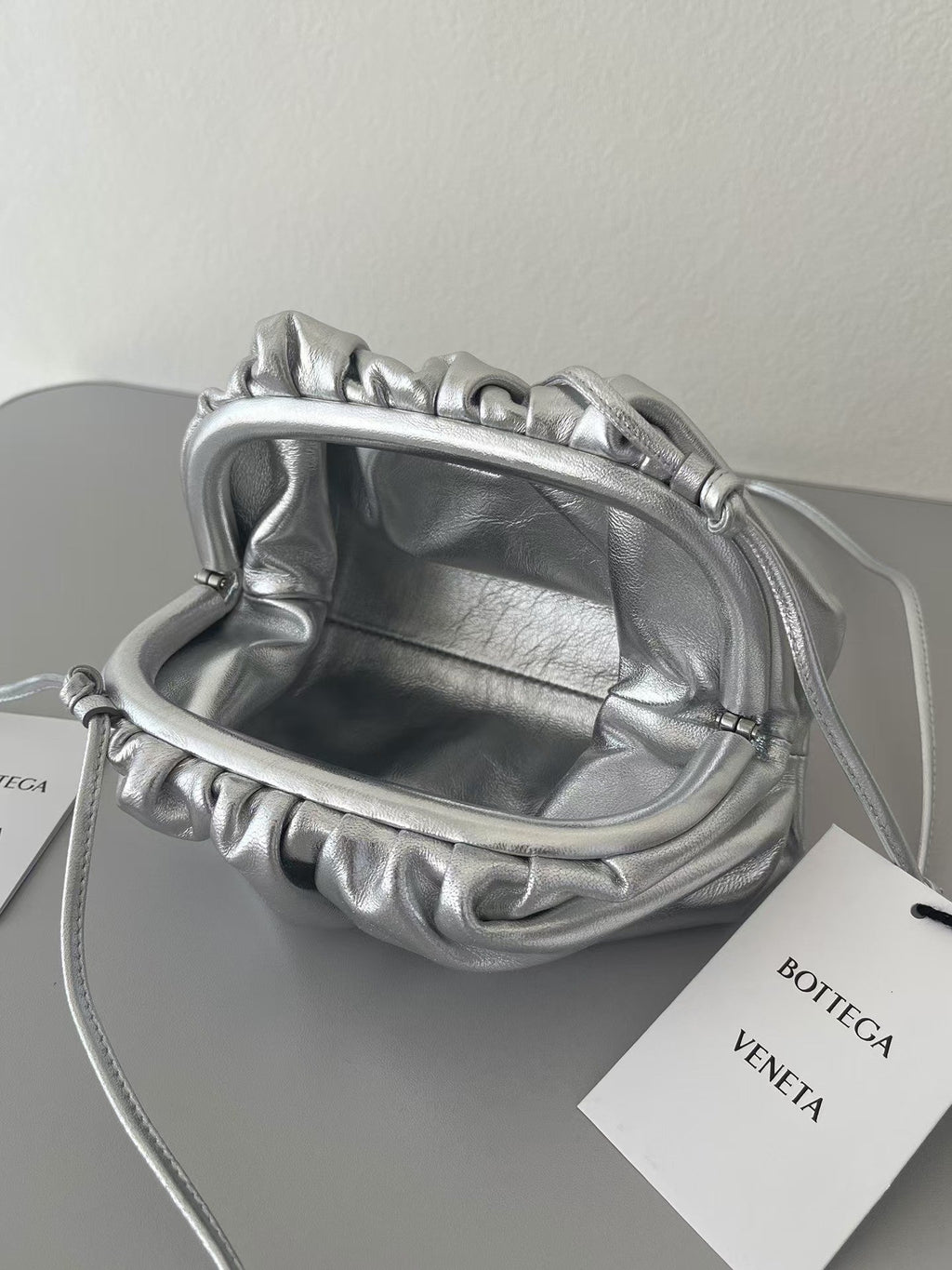 BOTTEGA VENETA 26S POUCH BAG IN SILVER METALLIC LEATHER